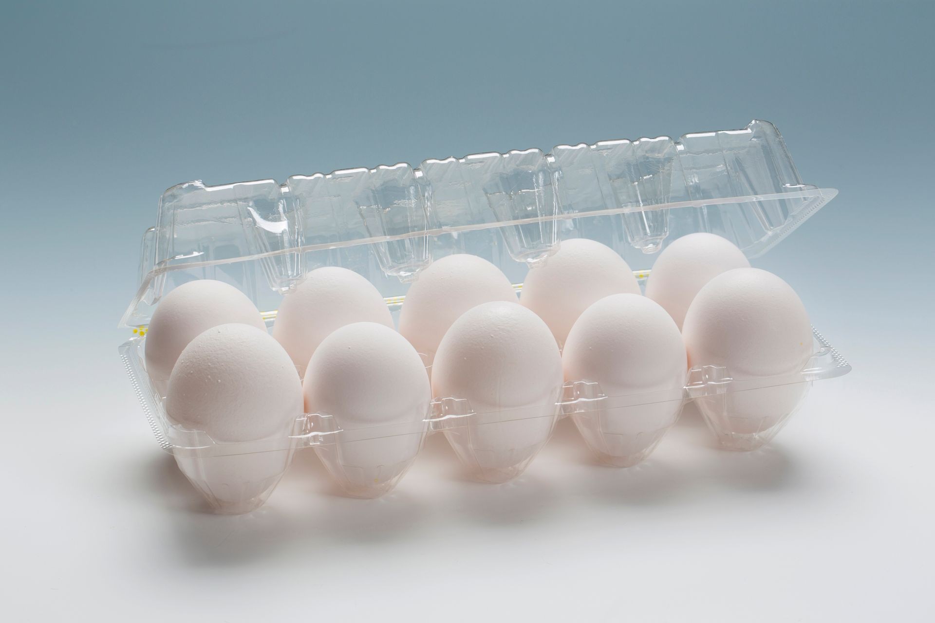 Eggs in a plastic package with isolated white background.